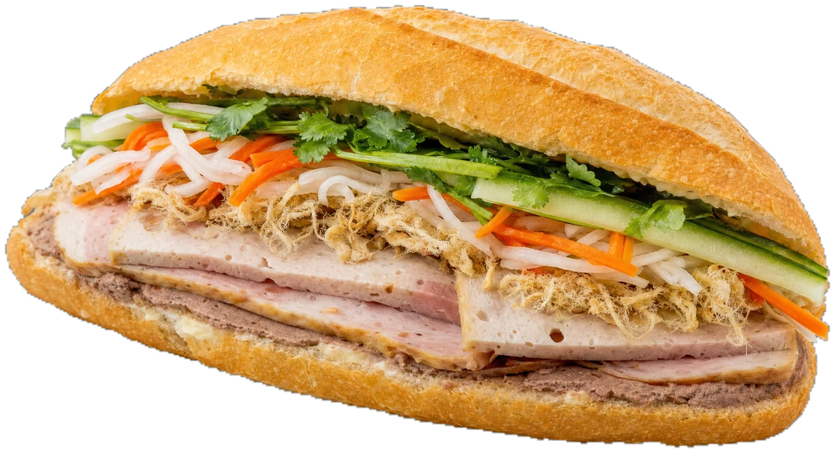 Classic bánh mì, cut open to show ham, pâté, chicken floss, cilantro and pickled vegetables